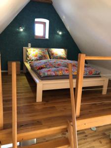 Кровать или кровати в номере Fewo Pflaumi 1