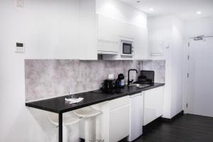 Kuchyňa alebo kuchynka v ubytovaní Coccoloba Suites Corralejo