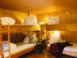 a room with two bunk beds in a cabin at Selbstversorgerhaus Herisch in Schladming +93 photos