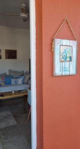 a living room with a wall with a painting on it at Casa Doris in San Sebastián de la Gomera