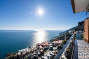 a view of the water with boats in a harbor at Torre di Amalfi - holiday house in Amalfi +47 photos
