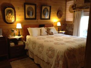 a bedroom with a bed with a teddy bear on it at Southdown Stable in Bowral