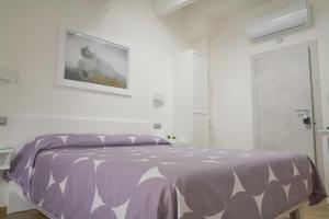 Postel nebo postele na pokoji v ubytování B&B Residenza Aragonese