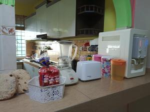 a kitchen with a counter with a blender on it at D'Diana Homestay in Port Dickson
