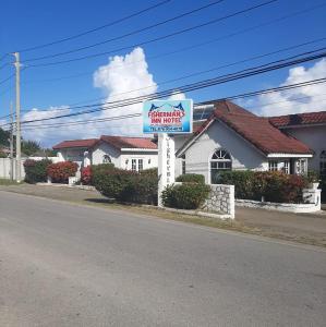 a sign for a steak house on the side of a road at Fisherman's Inn in Florence Hall