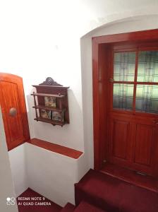 a stairway with a red door and a red carpet at Atlantis Apartmán 3 in Klášterec nad Ohří +34 photos