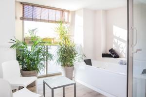 Posteľ alebo postele v izbe v ubytovaní Coccoloba Suites Corralejo