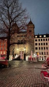 a large stone building with a tree in front of it at City Centre in Copenhagen