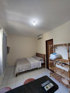 Cama o camas de una habitación en Residence Rota do Sol