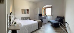 Postel nebo postele na pokoji v ubytování Hotel Mom Assisi