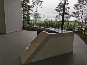 a concrete counter with a sink on a patio at Horizon Suites poolview near KLIA in Sepang