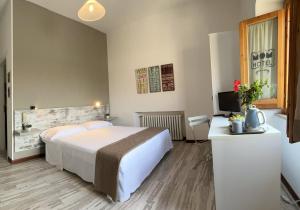 Krevet ili kreveti u jedinici u okviru objekta Hotel Mom Assisi