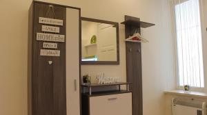 a room with a door and a mirror and a refrigerator at LEO Apartment Obchodna - Family in Staré Mesto +30 photos