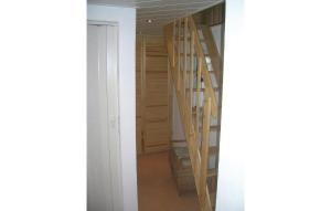 a room with a hallway with wooden stairs in it at Gorgeous Home In Schlema Ot Wildbach With Kitchen in Schlema