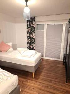 Postel nebo postele na pokoji v ubytování Aulbach' s Appartments