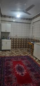 an empty room with a kitchen and a rug on the floor at apartment for rent in Luxor