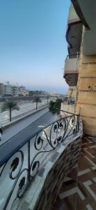 a balcony of a building with a view of a street at apartment for rent in Luxor