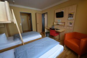 Voodi või voodid majutusasutuse JUFA Hotel Wangen im Allgäu toas