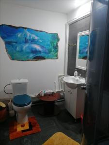 a bathroom with a toilet and a sink at Pensiunea Melissa in Măceşu de Jos +57 photos
