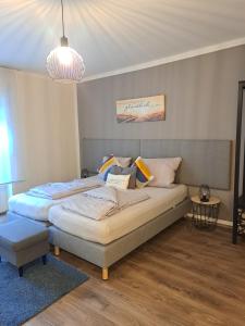 Postel nebo postele na pokoji v ubytování Aulbach' s Appartments