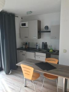 Η κουζίνα ή μικρή κουζίνα στο Apartment am Hochseilgarten +6 φωτογραφίες