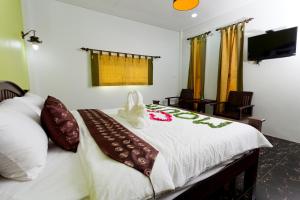 Ένα ή περισσότερα κρεβάτια σε δωμάτιο στο The Mouth Resort - SHA Extra Plus