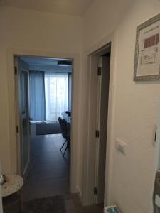 a hallway with a door leading to a room at Studio apartman Implex in Đakovo