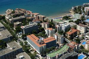 an aerial view of a city and the ocean at Ohtels Villa Dorada in Salou
