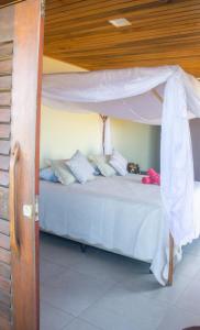 Postel nebo postele na pokoji v ubytování Beach Suites Villa Drisana