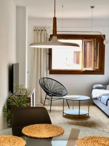a living room with two tables and a couch at Apartamento Costa Calida in San Pedro del Pinatar