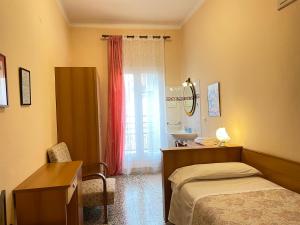 Postel nebo postele na pokoji v ubytování Hotel Panorama Bologna Centro