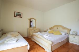 Posteľ alebo postele v izbe v ubytovaní Apartment Ivanov