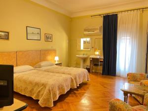 Postel nebo postele na pokoji v ubytování Hotel Panorama Bologna Centro