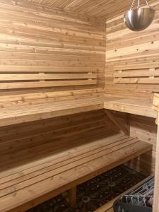 a sauna with wooden walls and a bench at Hallowell Rooming House in Hallowell