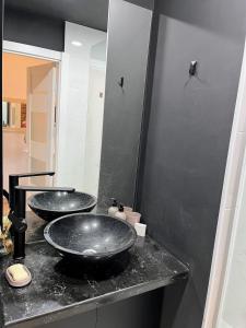 two sinks on a counter in a bathroom at New Gudauri, Alpic, Gudauri in Gudauri +6 photos