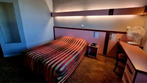Postel nebo postele na pokoji v ubytování Hôtel Siatel Besançon Chateaufarine