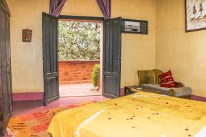 Postel nebo postele na pokoji v ubytování Riad Kasbah Omar