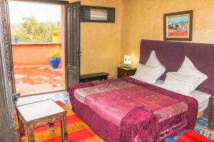 Postel nebo postele na pokoji v ubytování Riad Kasbah Omar