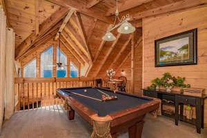 a room with a pool table in a cabin at *Family friendly cabin near Dollywood! in Pigeon Forge