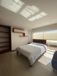 Ένα ή περισσότερα κρεβάτια σε δωμάτιο στο Hotel Campestre Villa Juliana