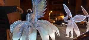 a group of angel statues on a street at night at Le Loft De La Robine 110m2 in Narbonne
