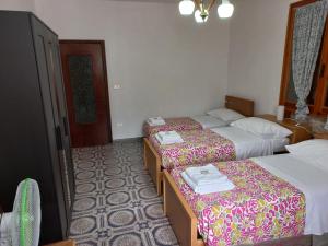 A bed or beds in a room at Appartamento Degli Dei (Affittacamere)