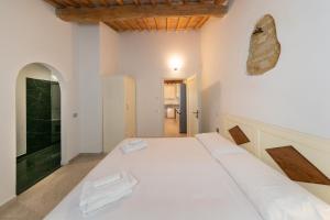 Posteľ alebo postele v izbe v ubytovaní Garden Relais Le Fontanelle