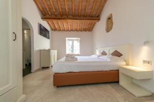 Posteľ alebo postele v izbe v ubytovaní Garden Relais Le Fontanelle