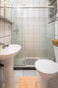 a bathroom with a shower and a toilet and a sink at Hotel Mama! Copacabana (Posto1 -Leme) in Rio de Janeiro