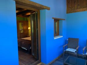 A bed or beds in a room at Hotel El Quintanal