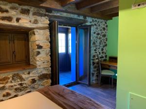 A bed or beds in a room at Hotel El Quintanal