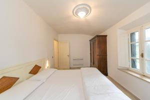 Posteľ alebo postele v izbe v ubytovaní Garden Relais Le Fontanelle