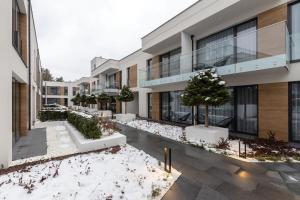 Apartamenty Olimpijska nad jeziorem Ukiel v zimě