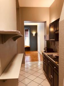 a kitchen with a stove and a counter top at Chaîne des puys chez William in Royat